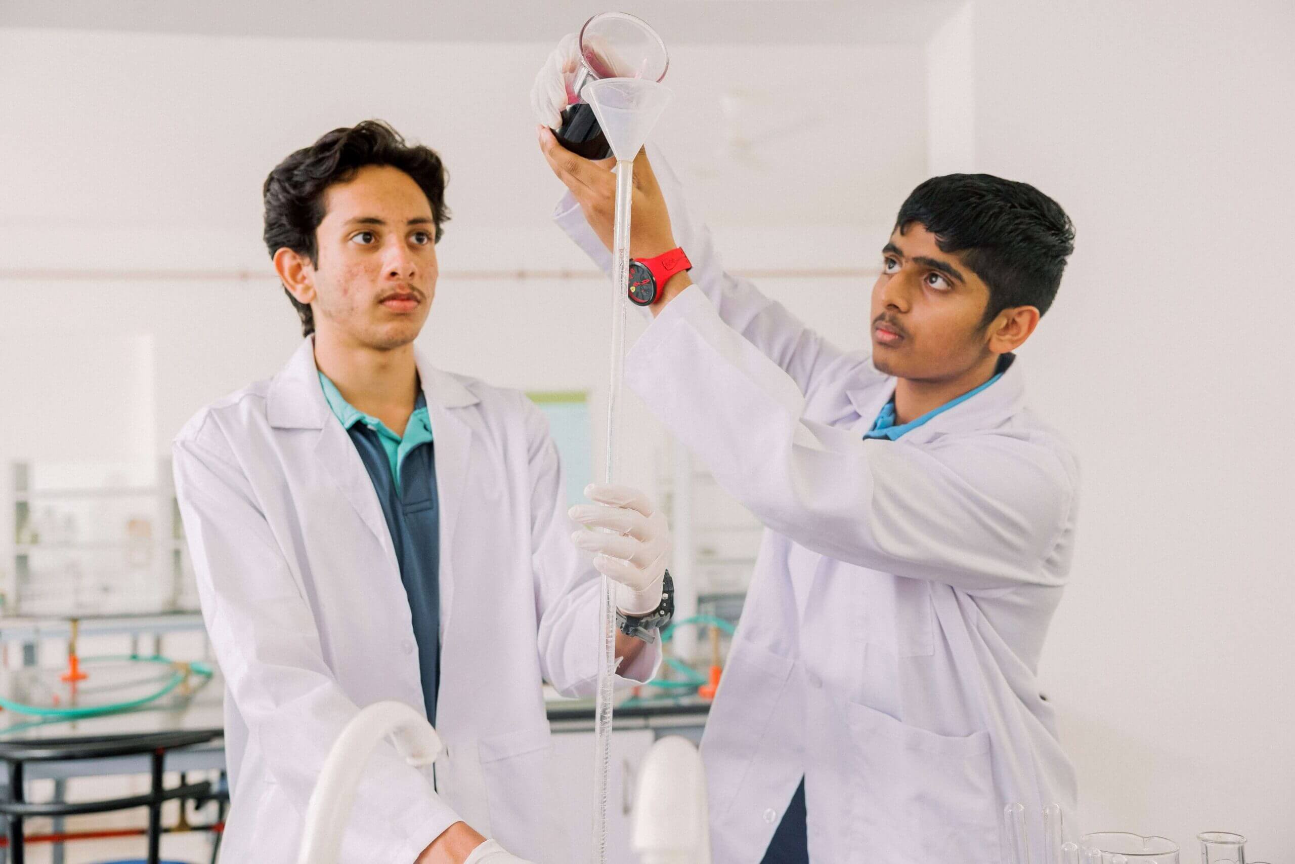 Best K-12 CBSE schools in Bangalore Ekya School Student experimenting in the lab