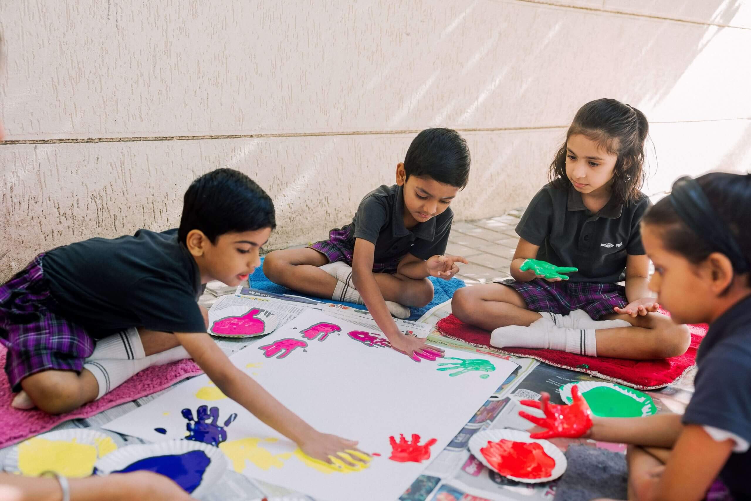 igcse syllabus schools in bangalore Ekya School Student playing with colors