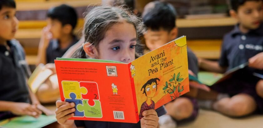 Ekya school student reading book