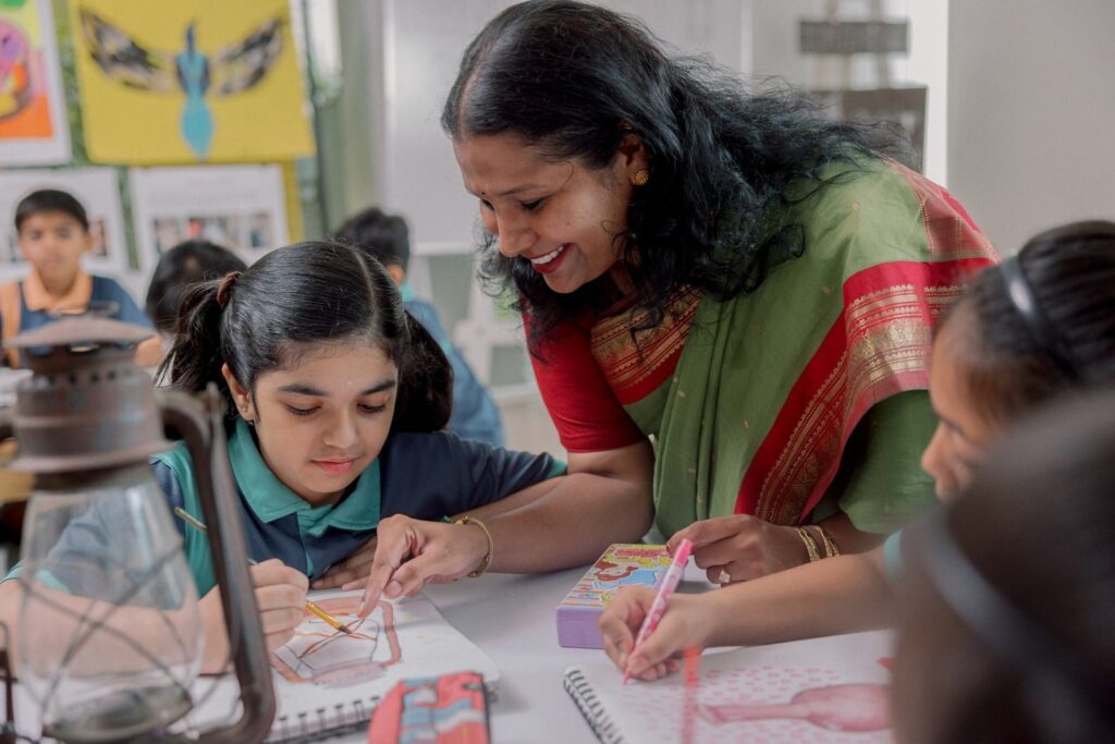Ekya School Student With Teacher in drawing class