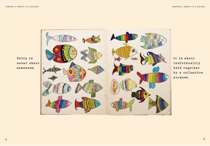 Colorful, patterned fish drawings fill an open book. Text reads, "Unity is never about sameness; it is about individuality held together by a collective purpose." The tone is vibrant and thoughtful.