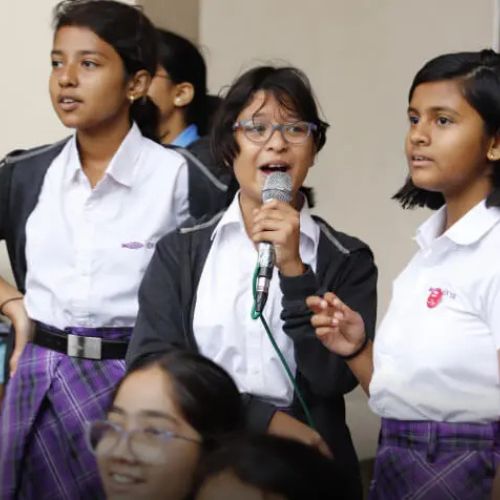 Ekya School students Holding