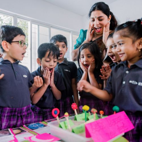 Ekya Students with teacher craft activity